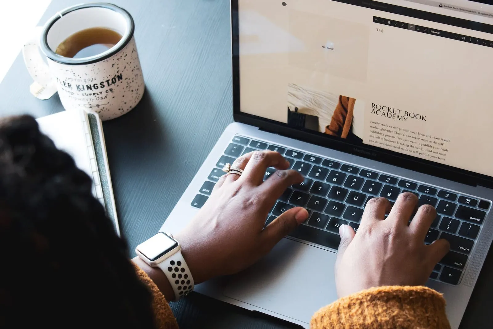 a person typing on a laptop